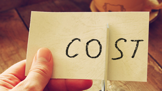 hand holding a piece of paper that says cost