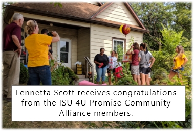 Lennetta Scott receives congratulations from the ISU 4U Promise Community Alliance members.